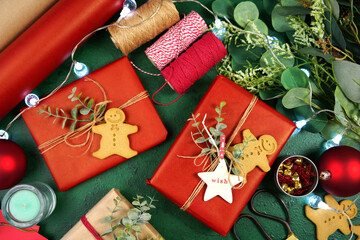 Christmas red and green theme gift wrapping top view blog hero header creative composition flat lay. Close up.