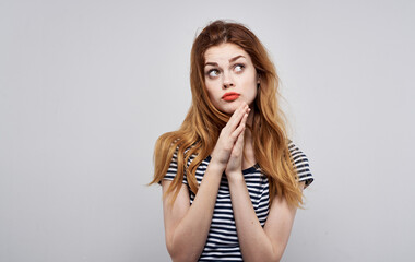 emotional woman with bright makeup gesturing with hands on gray background Copy Space