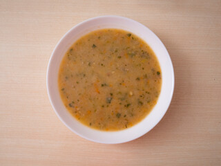 minestrone plate top view, soup plate in the center forms a circle still life food, boring food concept