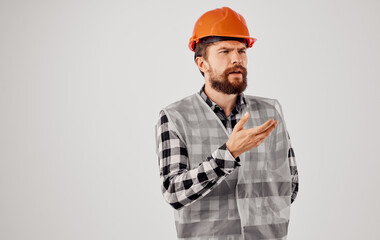 Man in construction uniform orange hard hat emotions of a construction professional