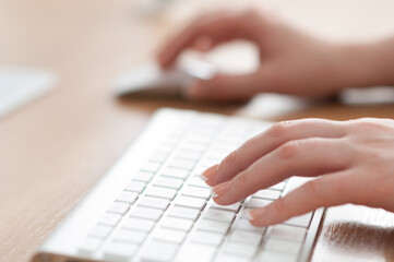 Typing on a keyboard.