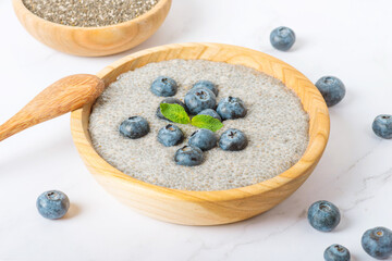 Fototapeta na wymiar chia pudding with blueberries in a coconut bowl