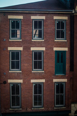 Fototapeta na wymiar Brick Building With Door As Window