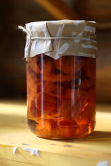 Jar of jam on a wooden shelf