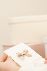 Woman holding a wedding invitation