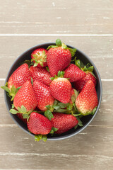 Closeup shot of a bowl of fresh juicy strawberries