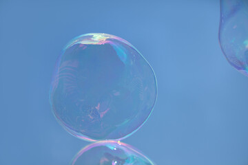 Soap Bubbles Against Clear Sunlit Blue Sky