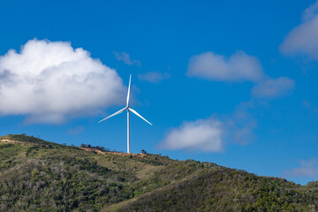 Close up view of the windmill on the green mountain with cloudy sky and, Punta Rucia, Dominican...