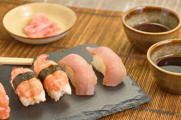 Closeup shot of salmon nigiris on a board