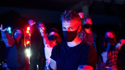 In protective masks. Group of protesting young people that standing together. Activist for human rights or against government