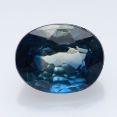 Natural blue sapphire on a white background