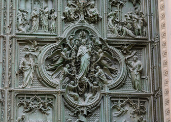 The doors of the Milan Cathedral. Fragment. Duomo Cathedral. Italy.
