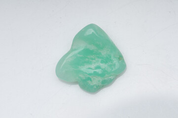 Natural chrysoprase stone on white background