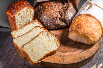 Various rustic bread on a wooden board. Healthy food and farming concept