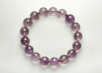 Bracelet with natural amethyst on a white background