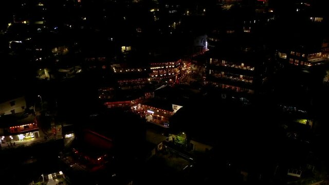 Aerial drone night view over mountain village of Jiufen, Taiwan.
Low angle, parallax movement, HD.