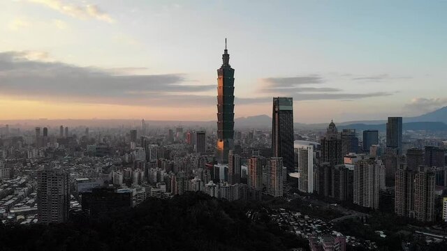 Aerial drone sunset view over Taipei 101 and Taipei city, Taiwan.
Mid angle, parallax movement, HD.