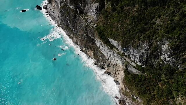 Aerial drone view over amazing blue sea at Taroko National Park coastline, Taipei, Taiwan.
Low angle, parallax + tilt movements, HD.