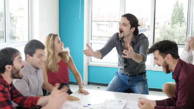 career, success-young co-workers are overjoyed at having finished their report