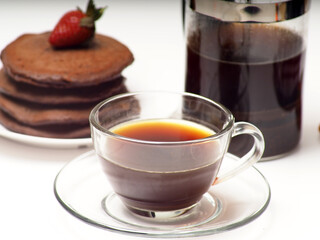 Close up shoot of stacked brown chocolate flafor pancake on an isolated white background