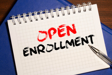 Doctor's desk with notebook and text - Open Enrollment