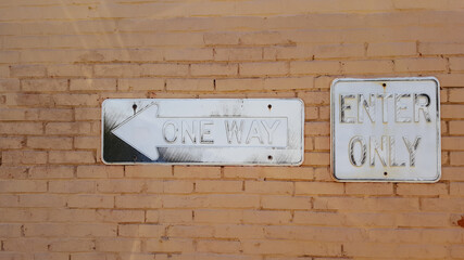 Faded One Way And Enter Only Signs 