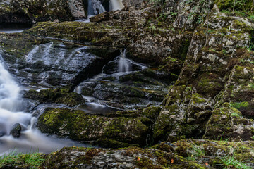 Waterfalls cascade surrounded by rocks