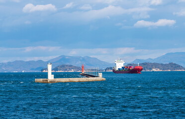 Seascape of white and red lighthouses in Takamatsu port , Takamatsu city, Kagawa, Shikoku, Japan