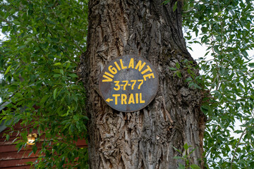 Sign posted on a tree for 3-7-77 - the symbol used b Montana Vigilantes (Vigilance Committee) in...