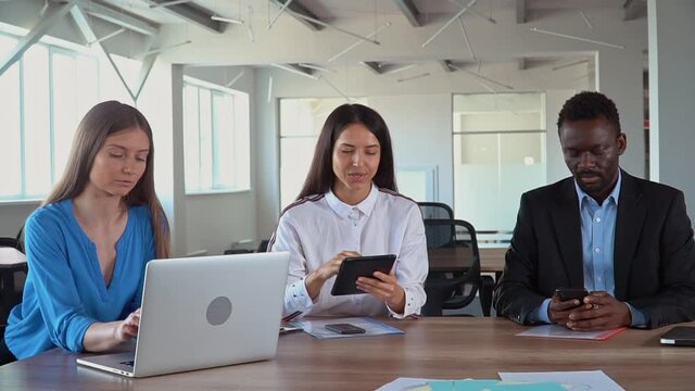 animus at work coworkers in office young woman holding digital table showing funny video slow motion