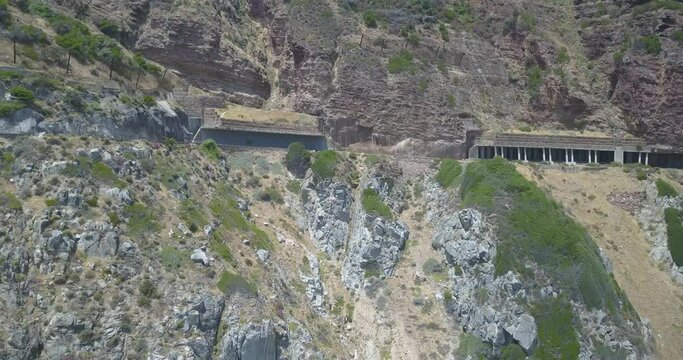 4K high quality aerial summer day footage of spectacular scenic Chapman's Peak Drive, rocky mountains, Atlantic Ocean views between Hout Bay and Noordhoek in Western Cape, Cape Town, South Africa