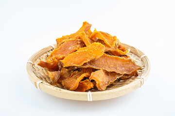 Dried sweet potatoes in a pot on white background