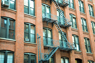 Apartment building with fire escapes in Brooklyn, NY
