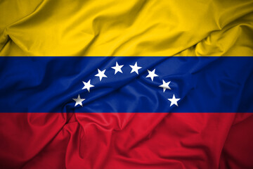 Venezuela National Flag. Horizontal tricolor of yellow, blue and red with an arc of eight white five-pointed stars centered on the blue band. Detailed silk, ripples and shadows.