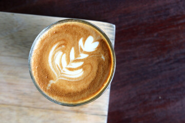 cup of hot latte art coffee