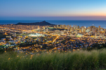 View of city lights with Diamond Head, Waikiki, and Honolulu at dusk on Oahu, Hawaii