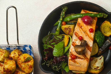 salmon with raw vegetables and cooked potatoes