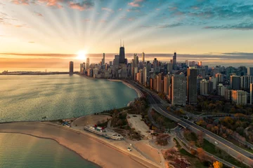Fotobehang Aerial view of Chicago Downtown skyline at sunrise with sun rays © marchello74