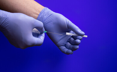 Use of sterilized medical supplies on blue background
