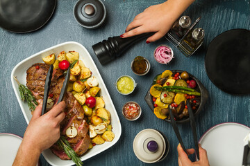 Hands on table with beef stew dressings and garnishes