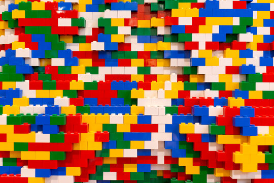 Stack of colorful lego brick background. Lego is a line of plastic construction toys that are manufactured by The Lego Group company in Denmark. DOHA, QATAR - 31 OCT 2019