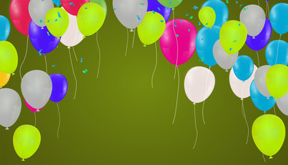 Green party balloons on the abstract background of jumble of rainbow colored balloons celebrating