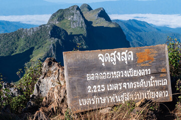 Chiang Mai, Thailand : 15/11/2020 : A wooden sign tell the information about highest point on top of Chiang Dao mountain peak the 3rd highest mountains of Thailand.