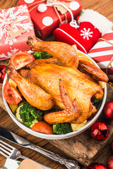 Roasted whole chicken with Christmas decoration.