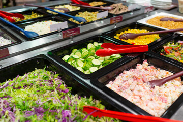 Variety of fresh colorful vegetable and fruit at salad bar corner