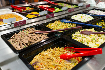 Variety of fresh colorful vegetable and fruit at salad bar corner