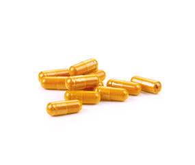 turmeric capsules on white background
