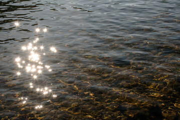 The sun reflecting on the lake