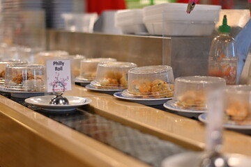 Plate sushi at a sushi bar