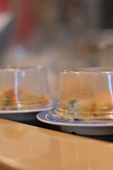 Plate sushi at a sushi bar